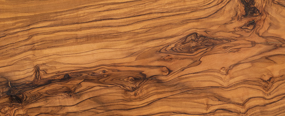 Close-up of a Olive Wood surface with a rich, brown grain pattern